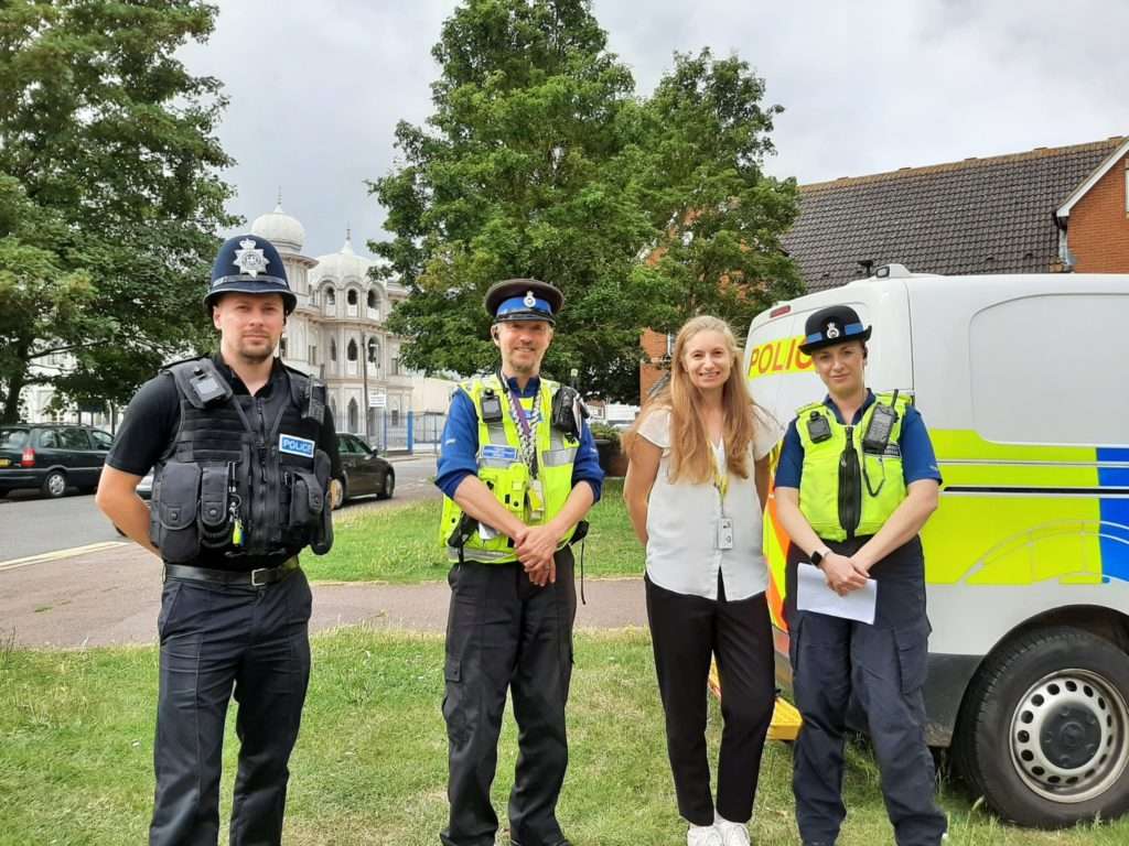 Officers infront of mosque